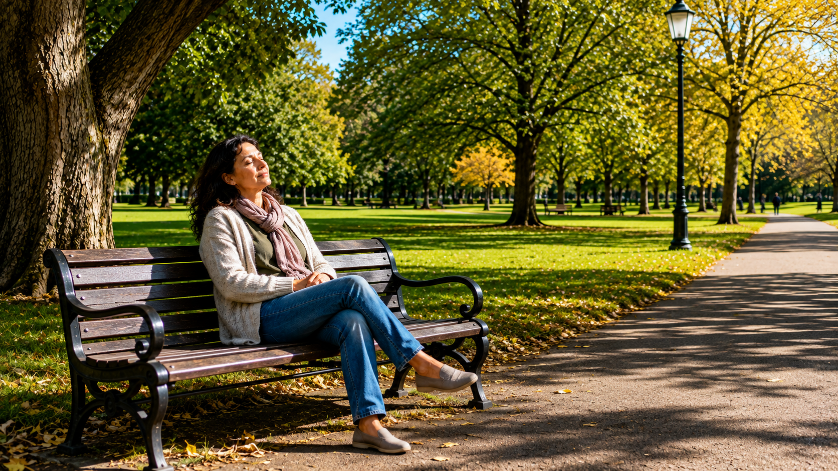 A caregiver resting peacefully on a park bench in the sunlight